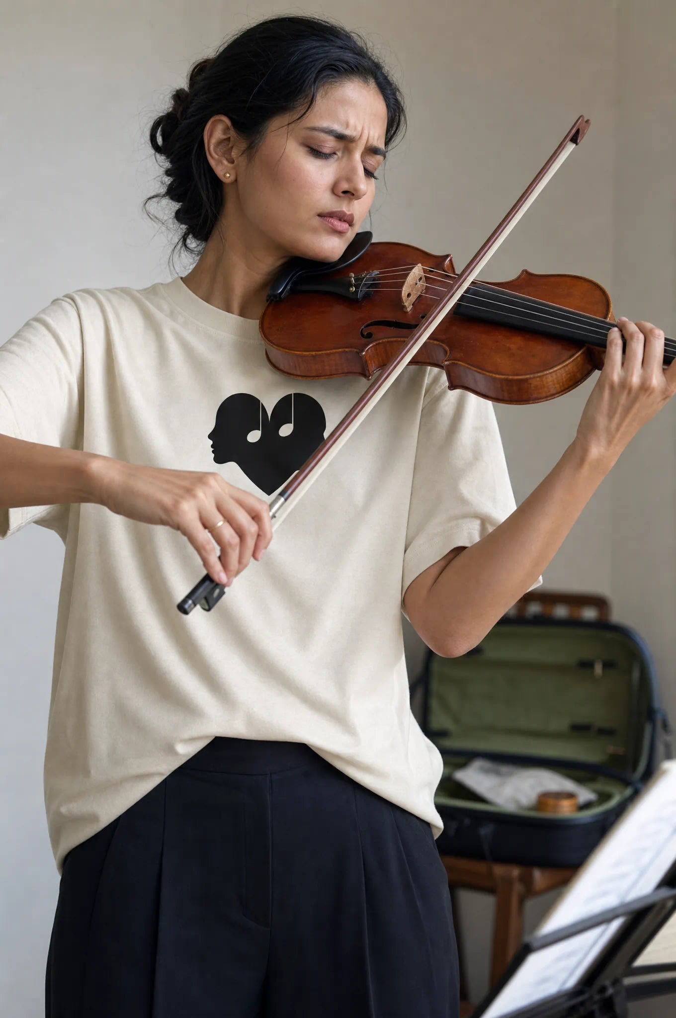 Woman playing the violin in the Alabaster Overture Oversized Tee