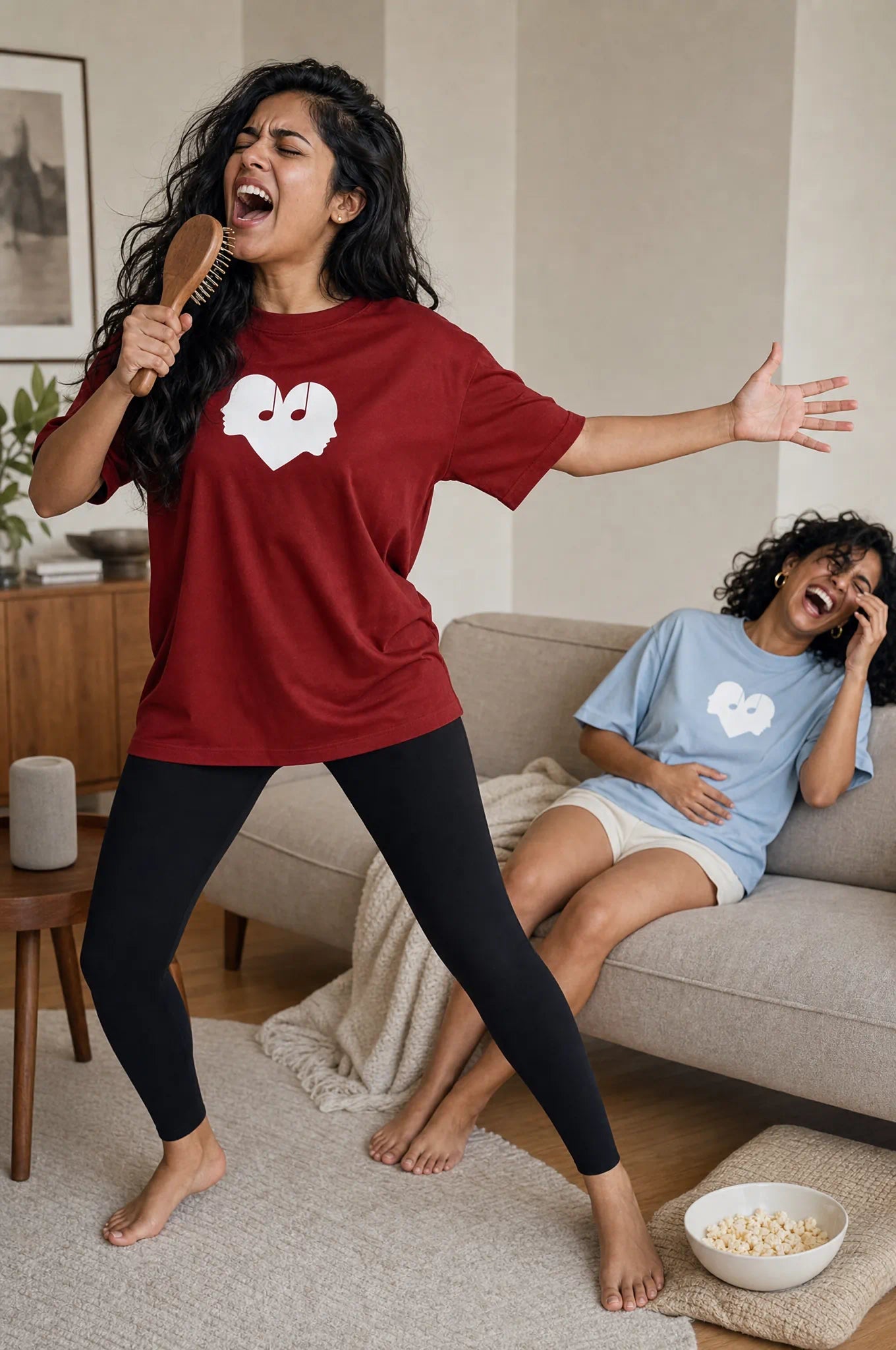 Friends sharing a musical moment singing together in Crimson and Horizon Overture Oversized Tees