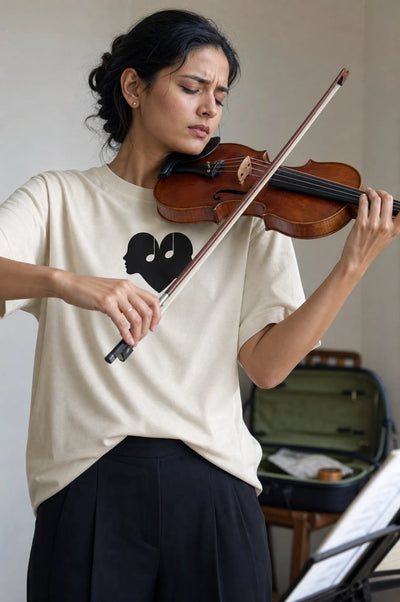 Woman playing the violin in the Alabaster Overture Oversized Tee