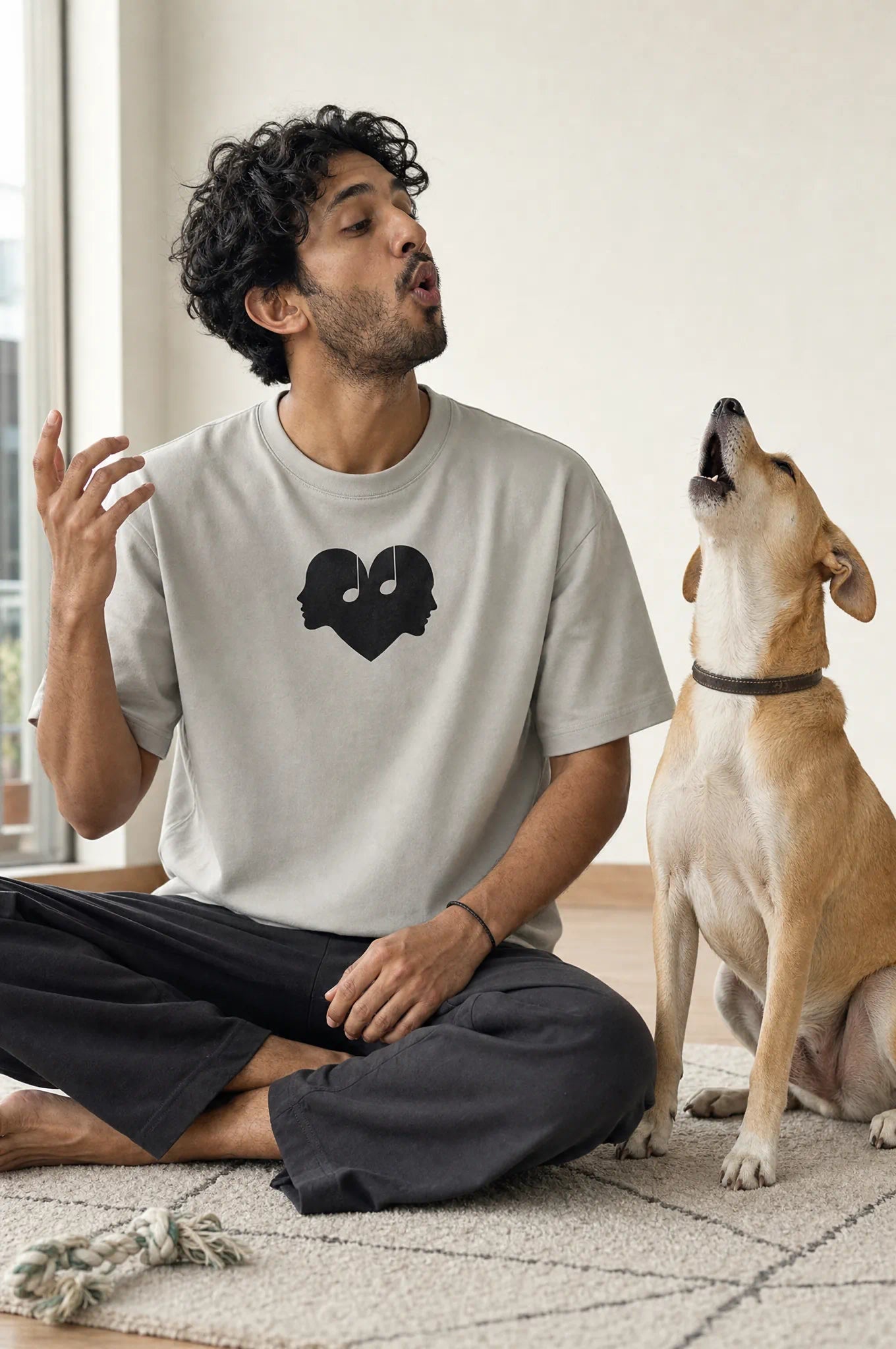 Man with his dog in the Ash Overture Oversized Tee