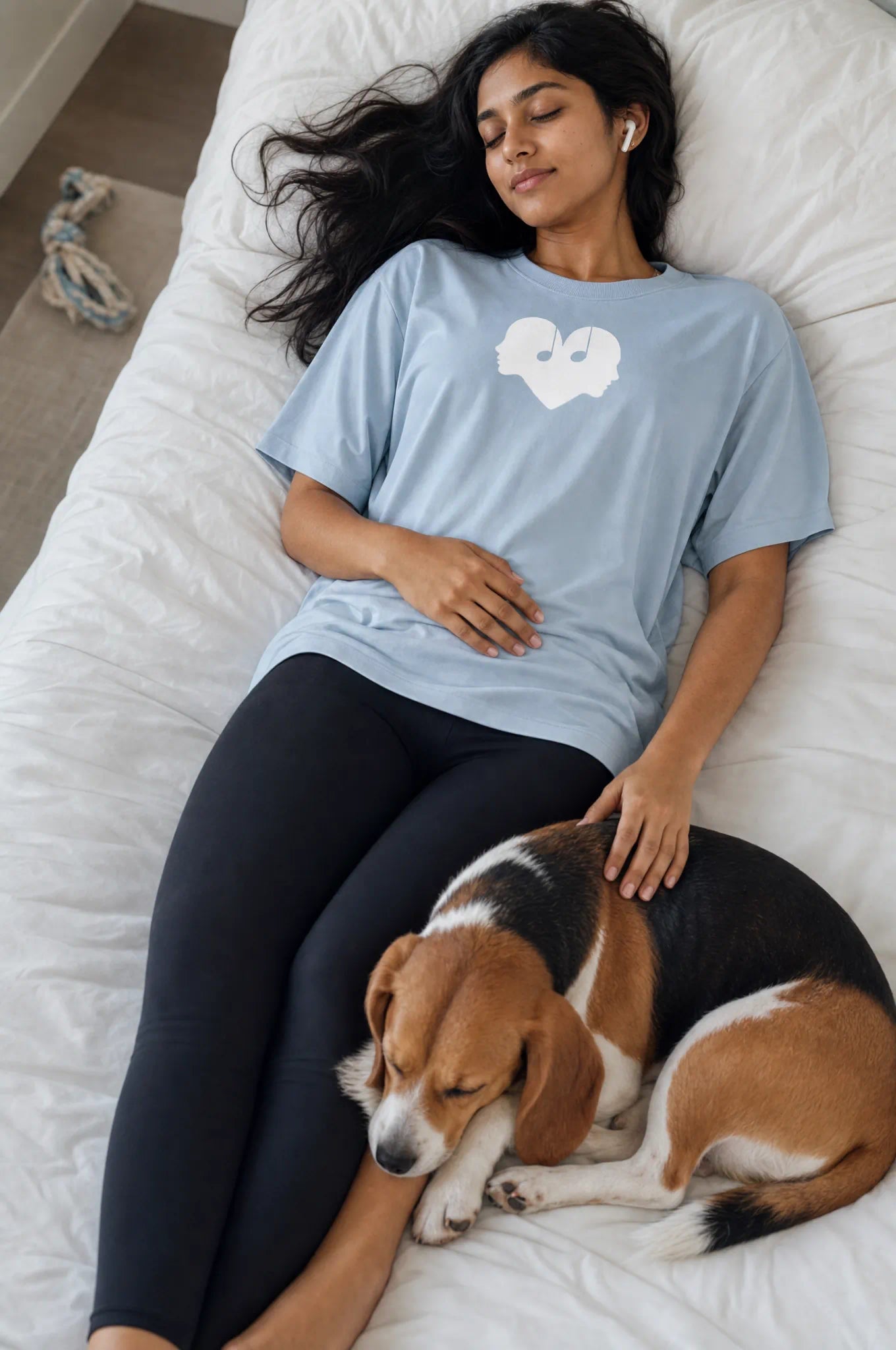 Woman listening to music in the Horizon blue Overture Oversized Tee