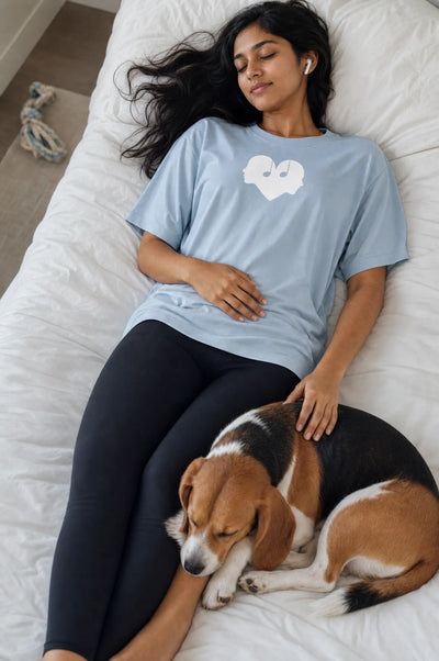 Woman listening to music in the Horizon blue Overture Oversized Tee