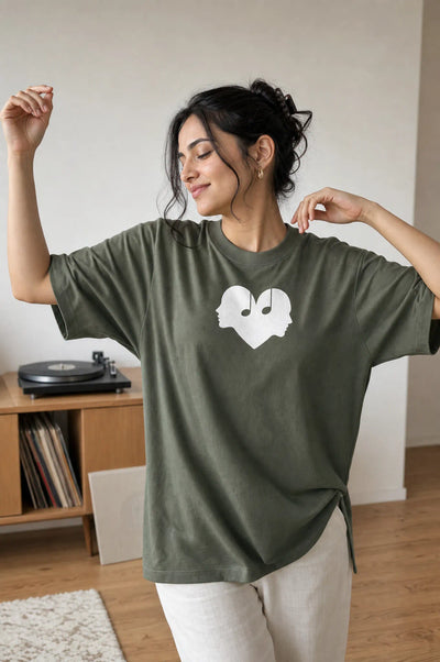 Woman dancing in the Juniper green Overture Oversized Tee