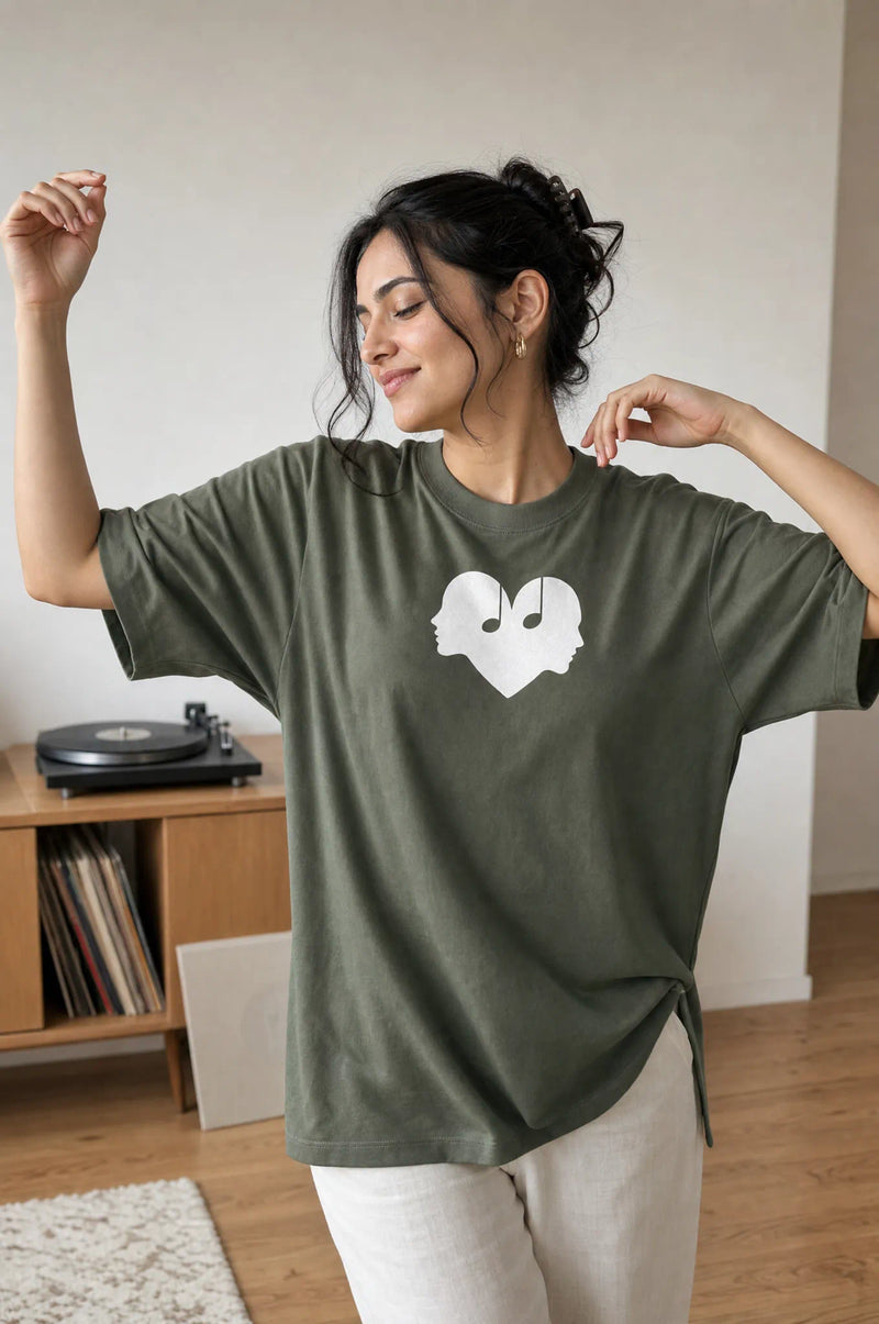 Woman dancing in the Juniper green Overture Oversized Tee